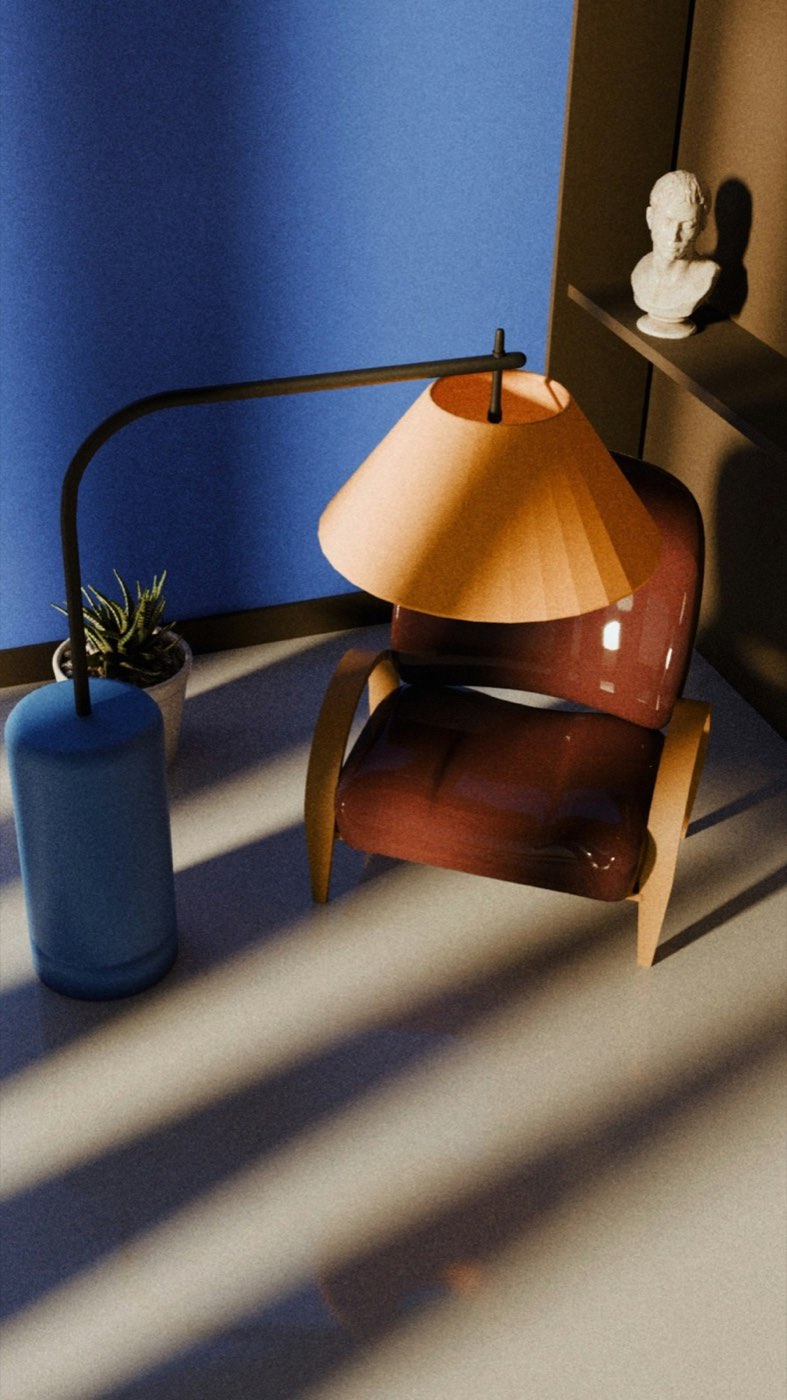 A brass floor lamp with an orange shade lighting a leather chair