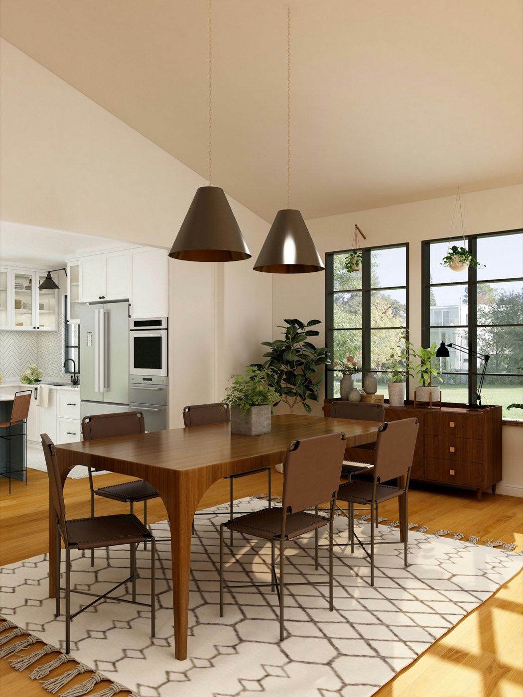 A dining area with a wooden table, black pendant lights and tall windows